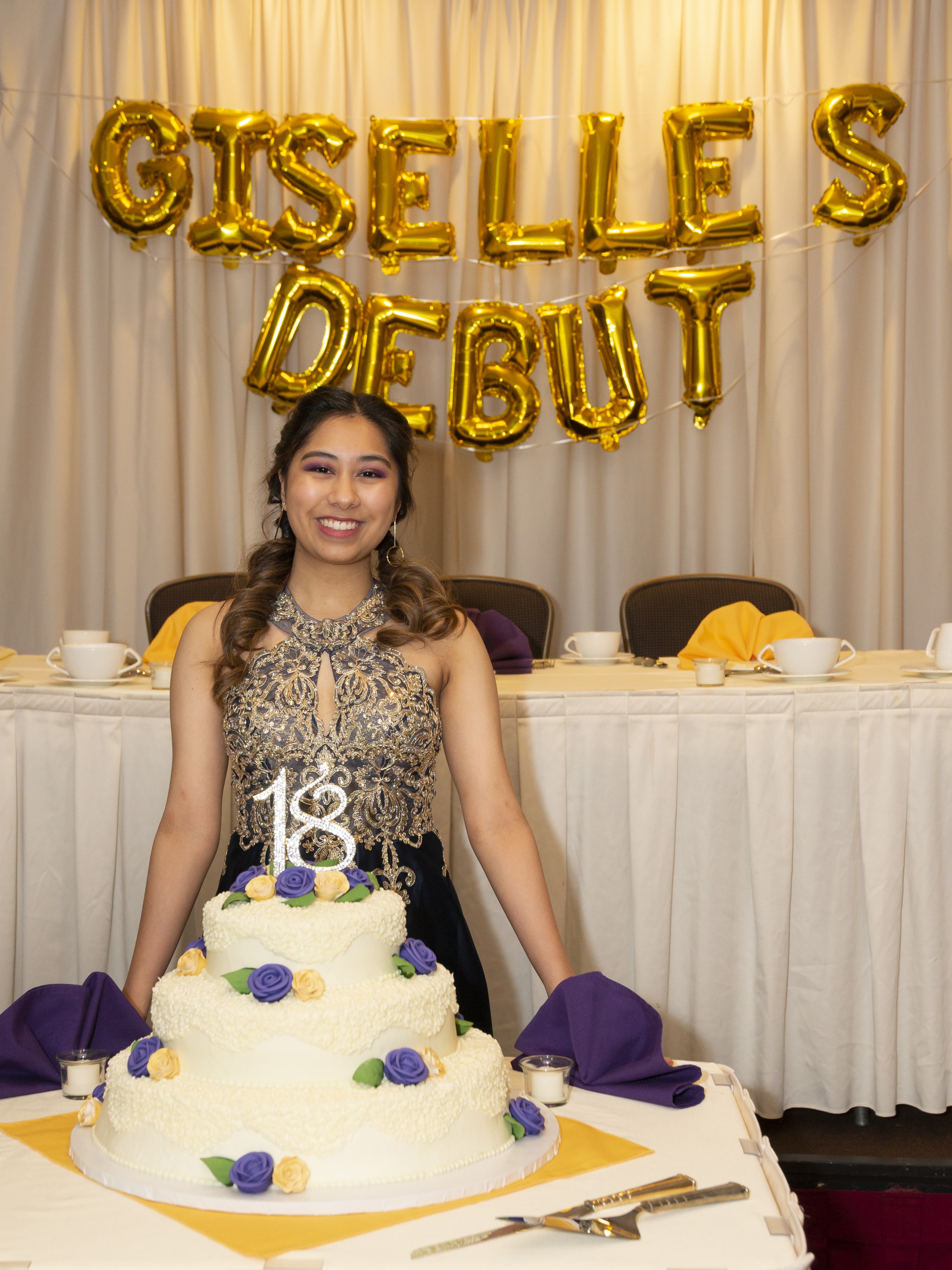 Giselle posing with their 18th birthday cake